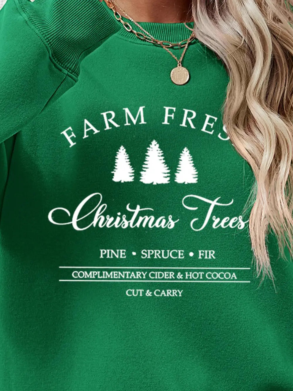Green graphic sweatshirt with Christmas trees and text details
