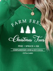 Green graphic sweatshirt with Christmas trees and text details