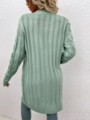 Light Green cable knit button-down cardigan with ribbed texture and cable sleeves.