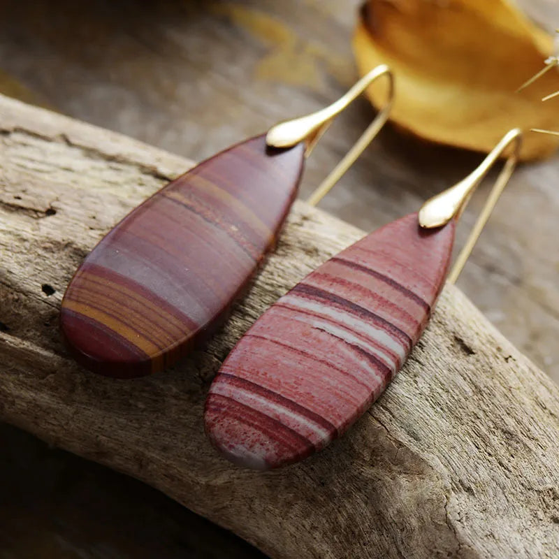 Stone grain teardrop dangle earrings with gold hooks and red and white striped stones