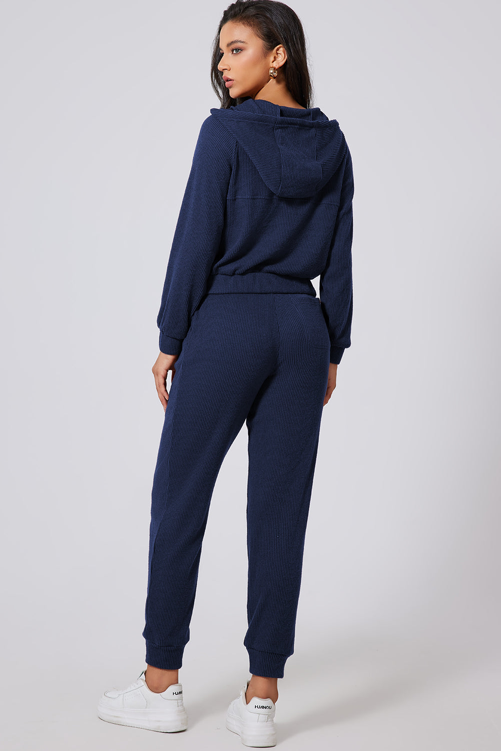 Navy ribbed crop hoodie and jogger set with drawstring waist and cuffed ankles.