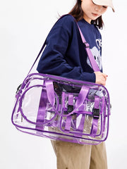 Chic clear PVC travel bag with purple accents and adjustable strap.