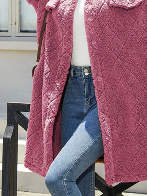 Quilted teddy bear coat in hot pink with diamond pattern and button front.