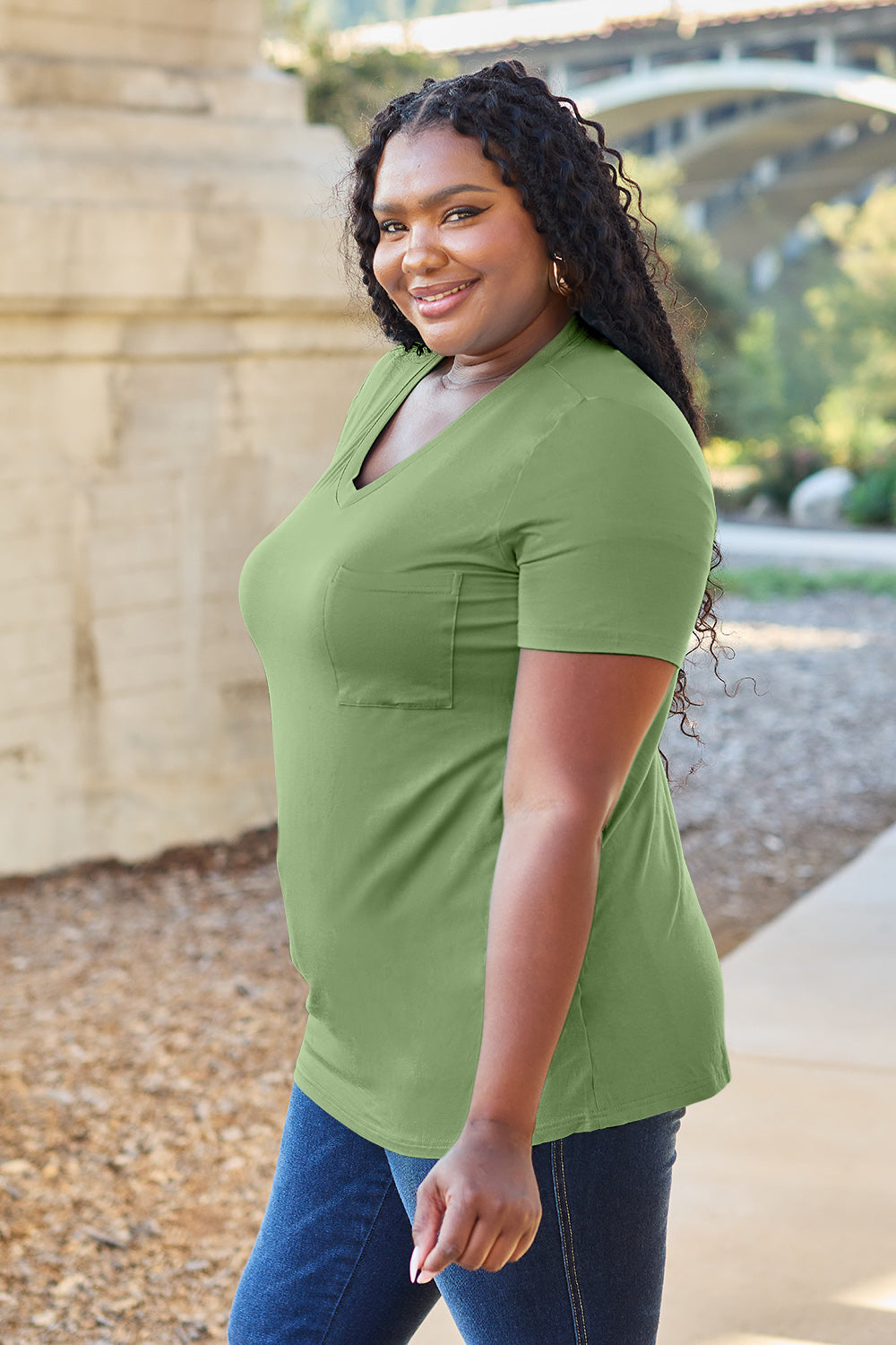 V-neck pocket tee in Matcha Green with short sleeves and a relaxed fit.