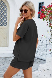 Black waffle knit henley short set with short sleeves and side slits on top.