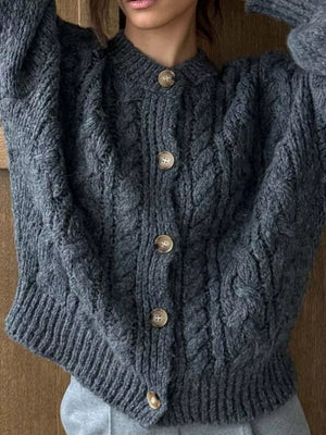 Gray cable-knit button-down cardigan with wooden buttons.