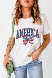 White graphic tee with "AMERICA" text and a patriotic bow motif.