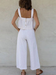 White linen crop top with button back and wide leg culottes.