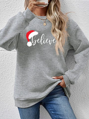 Gray raglan sweatshirt with "Believe" and Santa hat graphic, crew neck, long sleeves.