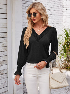 Black lace trim V-neck blouse with blouson sleeves and smocked cuffs.