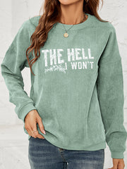 Textured corduroy crewneck sweatshirt in Gum Leaf with white graphic text and floral detail.