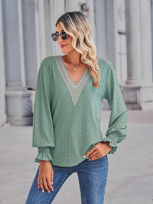 Lace trim eyelet sleeve blouse in Gum Leaf green with V-neck and ruffled cuffs.