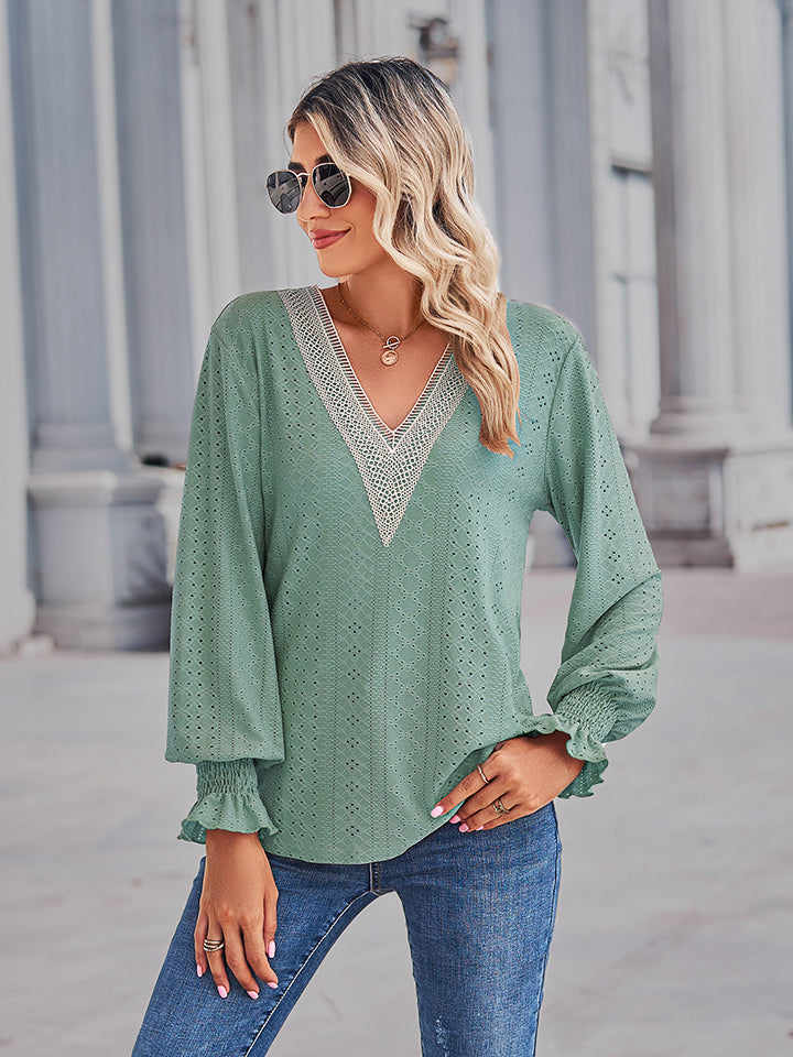 Lace trim eyelet sleeve blouse in Gum Leaf green with V-neck and ruffled cuffs.