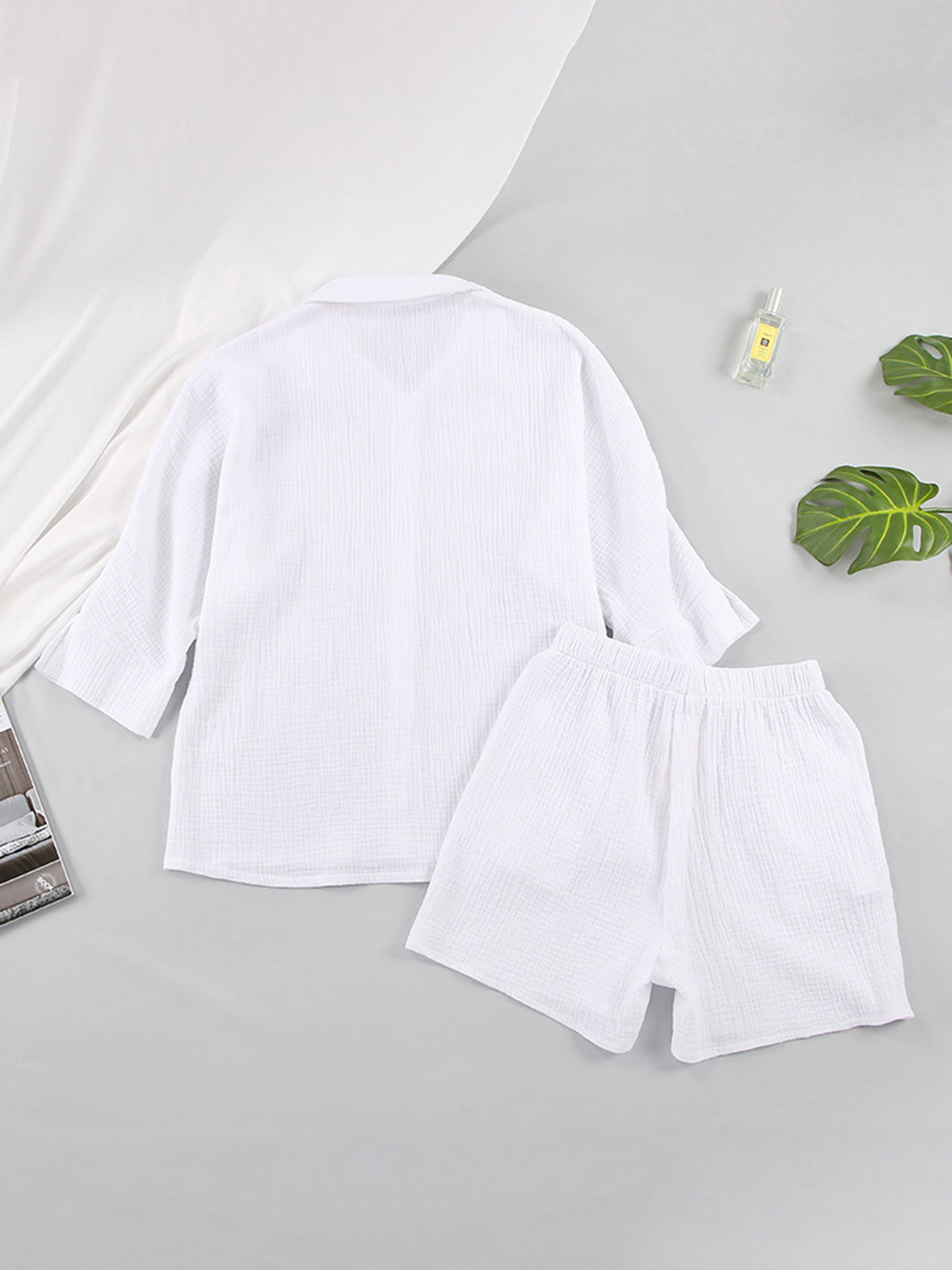 White gauze cotton resort shirt and shorts set with buttoned front and elastic waist.