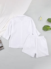 White gauze cotton resort shirt and shorts set with buttoned front and elastic waist.