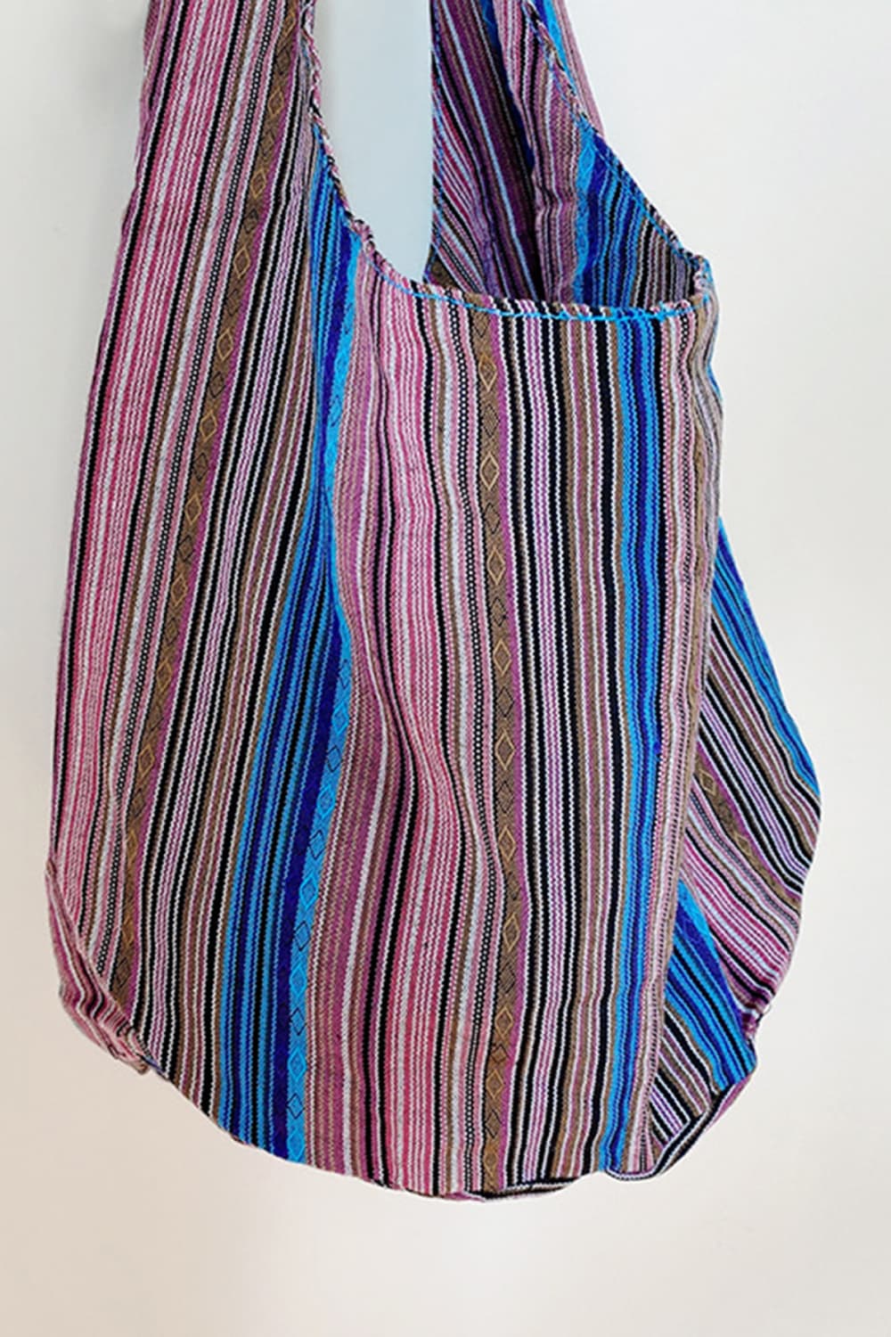 Tribal weave shoulder bag in multicolor with vertical stripes and diamond pattern detail