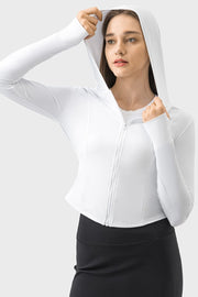 White active zip-up hoodie with thumbholes and a fitted silhouette.