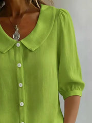 Yellow green button-down shirt with Peter Pan collar and puff sleeves.