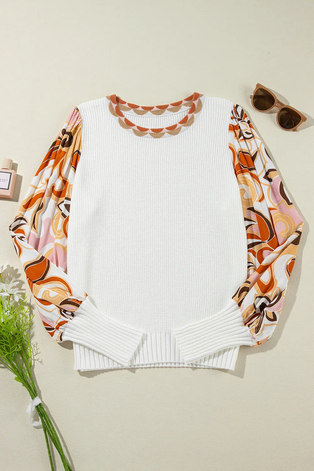 White knit sweater with scalloped neckline and colorful floral print puff sleeves