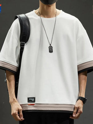 Men's white cotton blend t-shirt with contrast stitching and loose fit.
