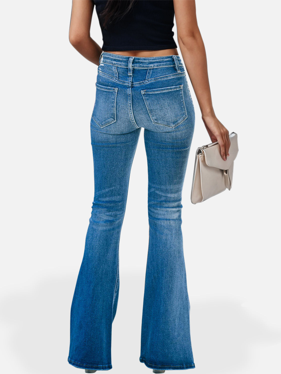 Button-fly flare jeans in medium wash denim with seam detail and a flared leg.