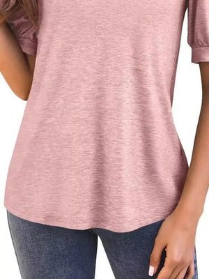 Light pink t-shirt with puff sleeves and a notched V-neck, shown on a model.