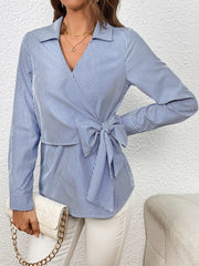 Sky blue and white striped wrap blouse with a bow detail and collar.