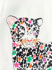 Toddler t-shirt with a white cotton base and a colorful leopard graphic featuring black spots, pink hearts, and floral