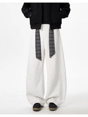 Light gray relaxed fit wide-leg sweatpants with plaid tie detail