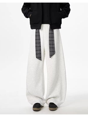 Light gray relaxed fit wide-leg sweatpants with plaid tie detail
