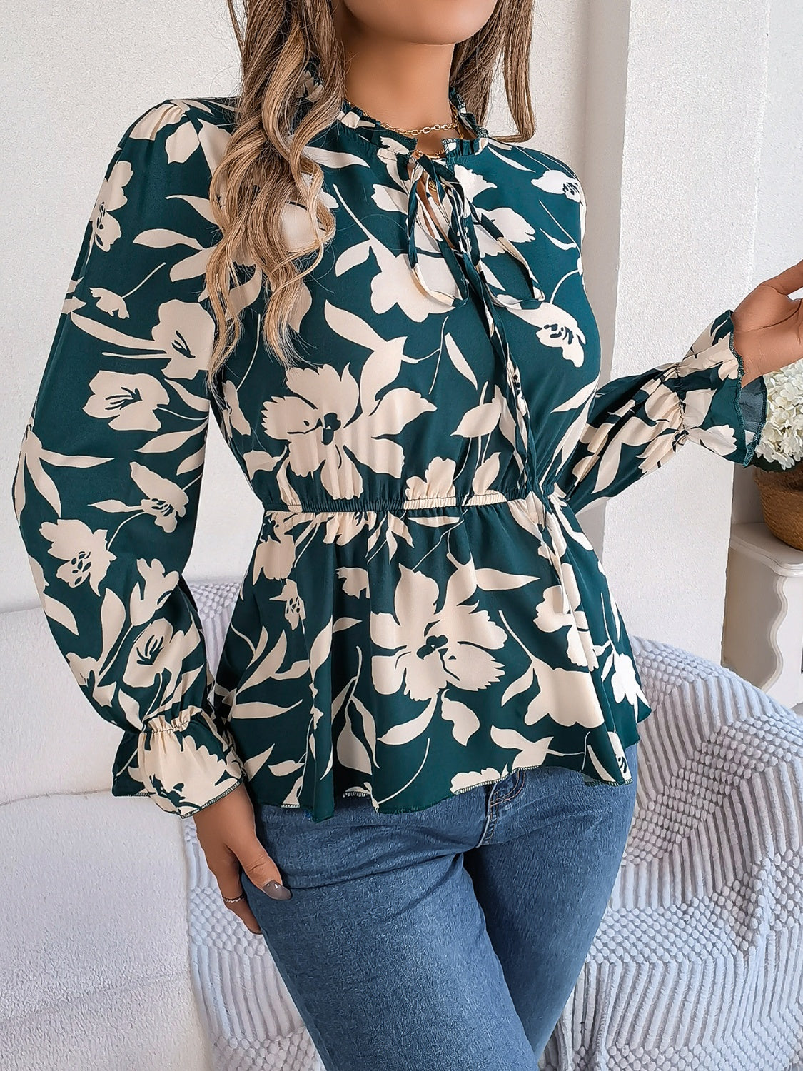 Deep Teal floral peplum blouse with ruffled neck and tie detail