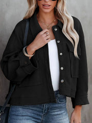 Black waffle knit cropped utility jacket with button front and chest pockets.