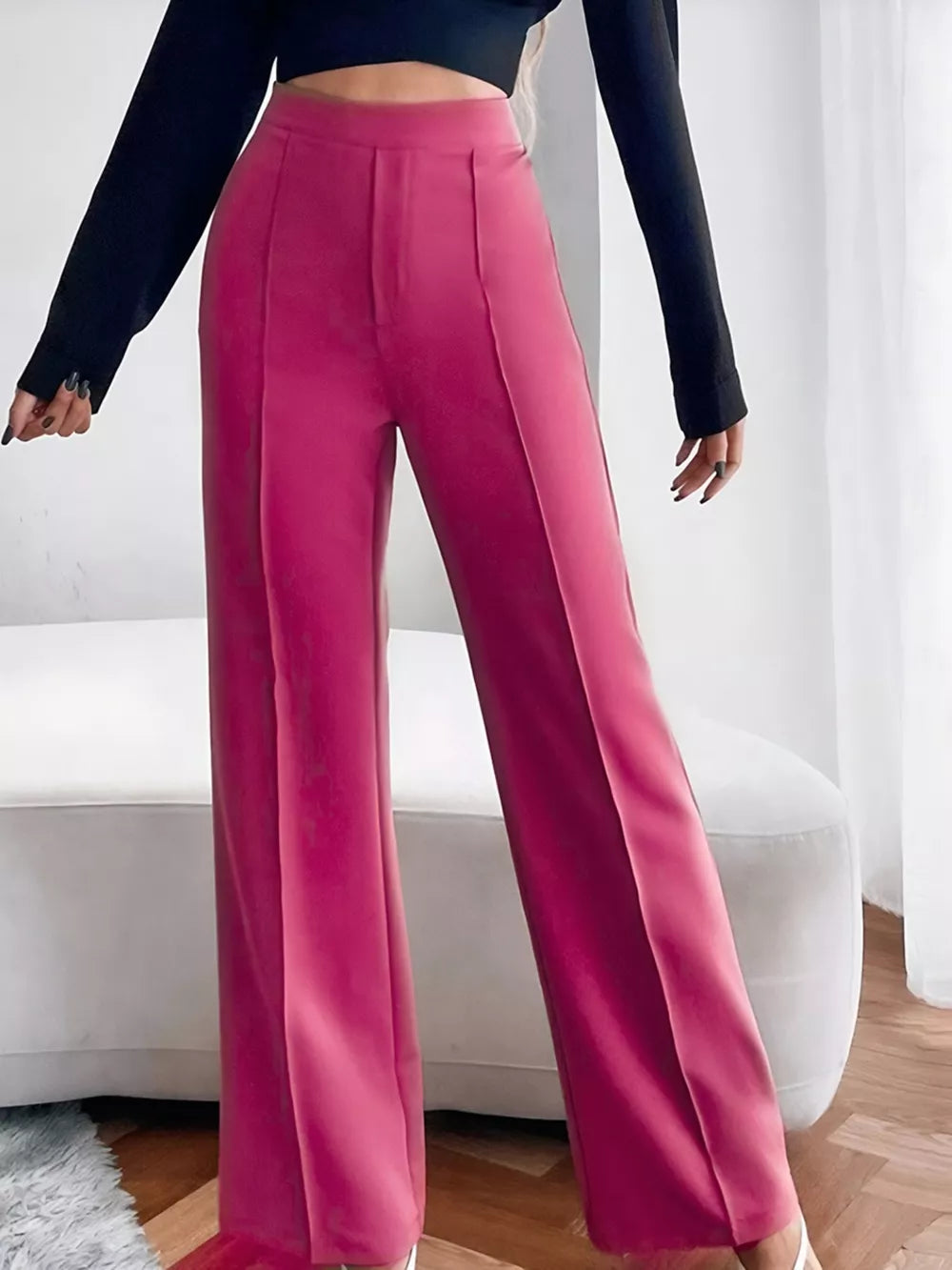 Sleek high-waisted flare maternity pants in cerise with front pleats.