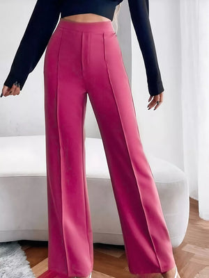 Sleek high-waisted flare maternity pants in cerise with front pleats.