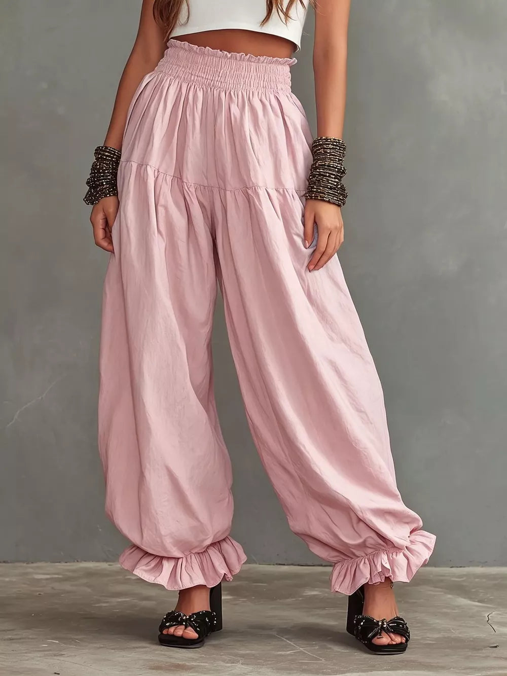 Full Size Smocked Ruffle Hem Wide Leg Pants in Mustard, model styling view