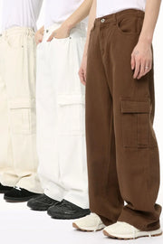 Brown cargo pants with flap pockets, shown on models with ivory and white pants.