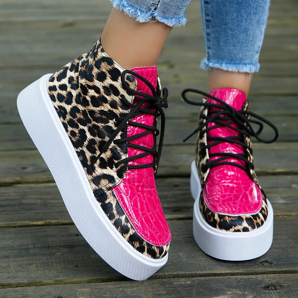Patent leopard platform high-tops with hot pink toe caps and black laces.