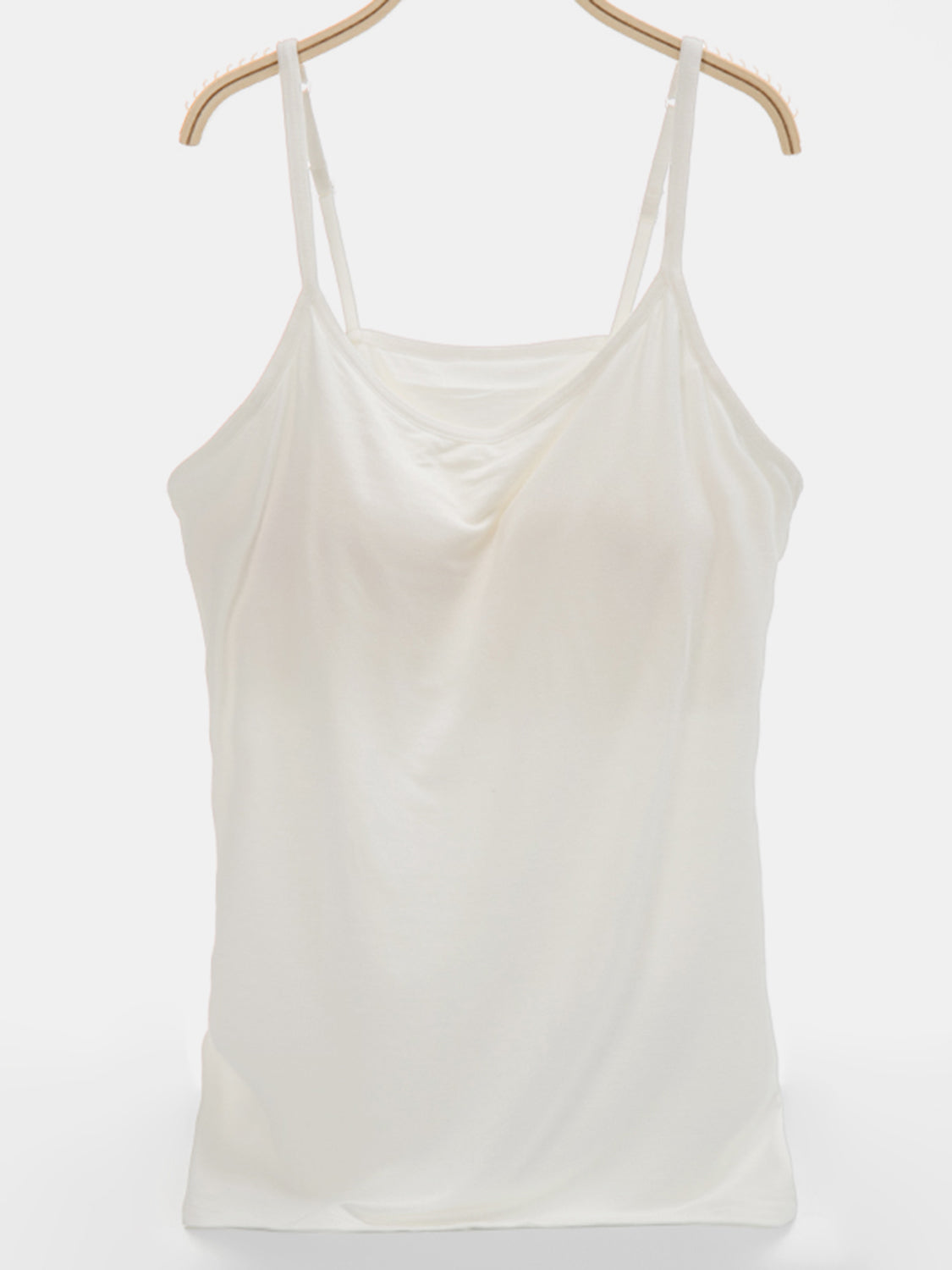 Ivory soft-cup cami with adjustable straps and a draped neckline.