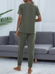 Moss green relaxed-fit tee and jogger set with cuffed ankles.
