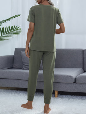 Moss green relaxed-fit tee and jogger set with cuffed ankles.