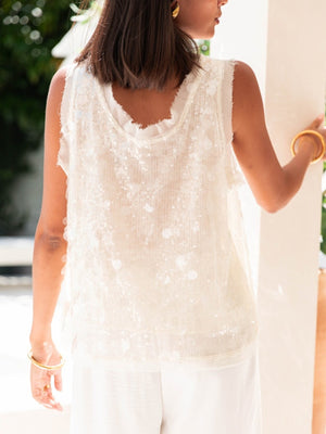 Ivory sequin embellished tank top with frayed neckline and raw hem.