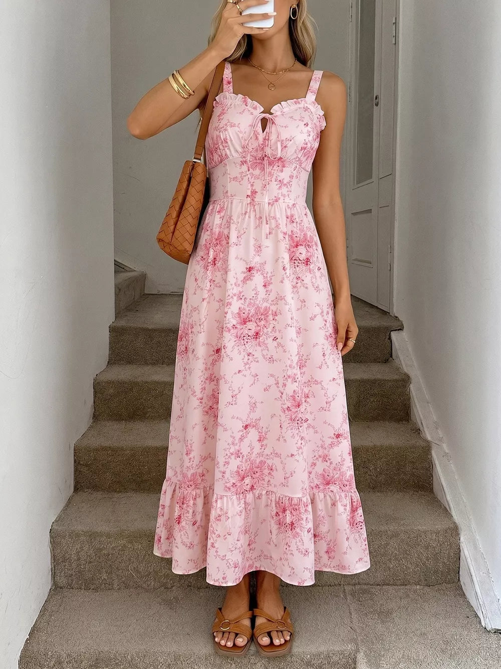 Pink floral cami midi dress with tie front and ruffled hem.