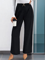 Black wide leg trousers with gold buckle detail and high waist