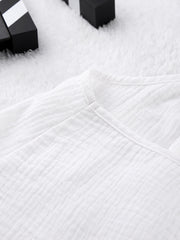 White cotton cami pajama top with textured fabric and V-neck detail