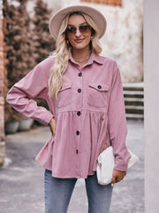 Pink corduroy peplum shirt jacket with button front, chest pockets, and flared hem.