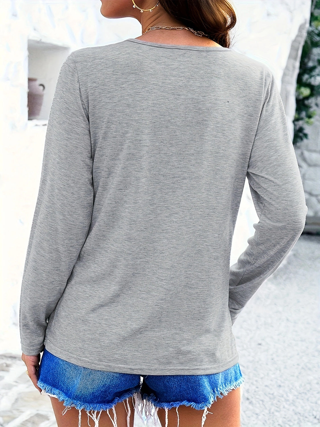 Light gray long sleeve tee with a lattice neckline detail.