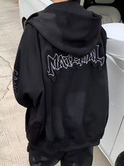 Black oversized zip-up hoodie with graphic detail on back and sleeve