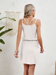 White eyelet crossover strap dress with cinched waist and short hem