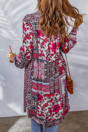 Patchwork print duster shirt jacket with floral and geometric patterns in pink, blue, and gray.