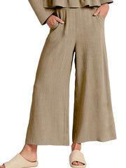 Khaki two-piece set with ruffled hem top and wide-leg pants with pockets.